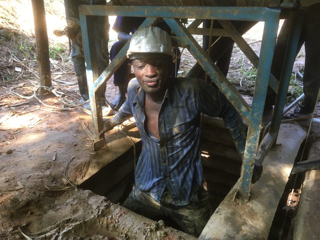 One of the Fairtrade Gold Uganda miners emerges from the timbered mine shaft at SAMA in Busia district Uganda.